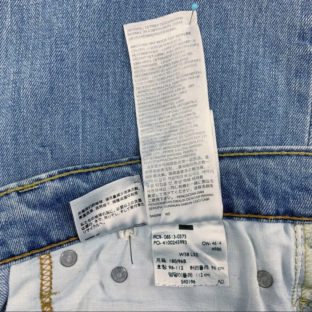 Levi’s 513 Slim Straight Distressed Light Wash Jeans